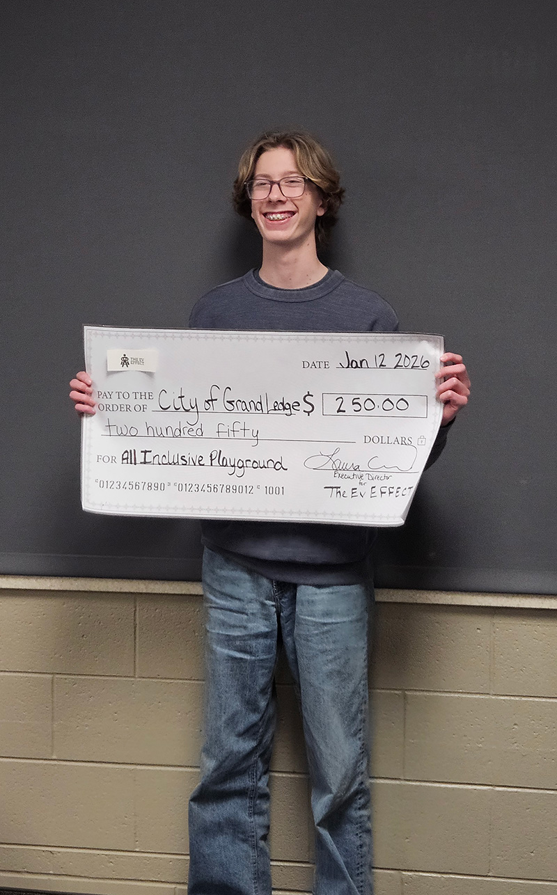 Charlie presenting his Ev Effect Pay-It-Forward Grant to the City of Grand Ledge